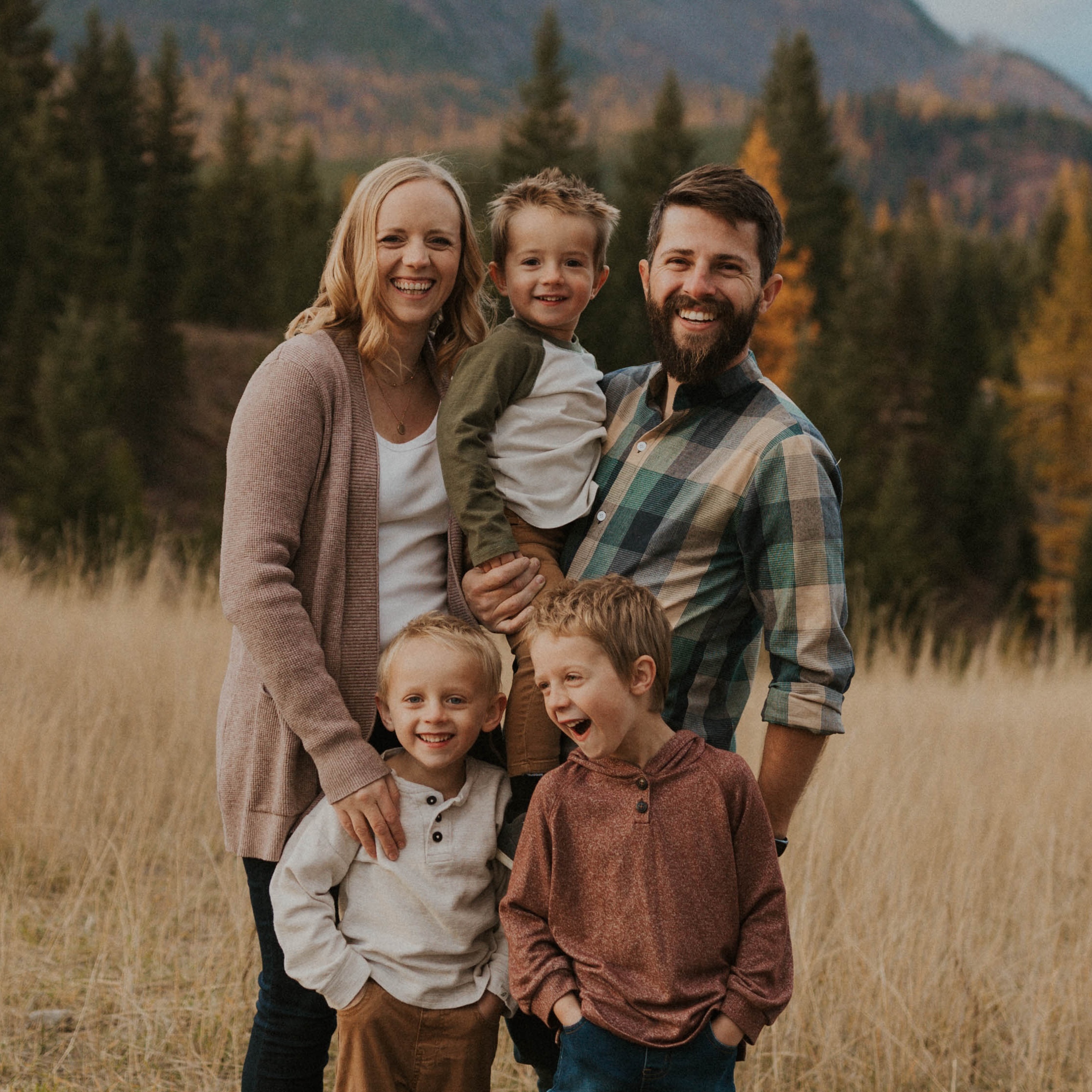 A photo of a family with Natalie Dance, her husband, and her boys.